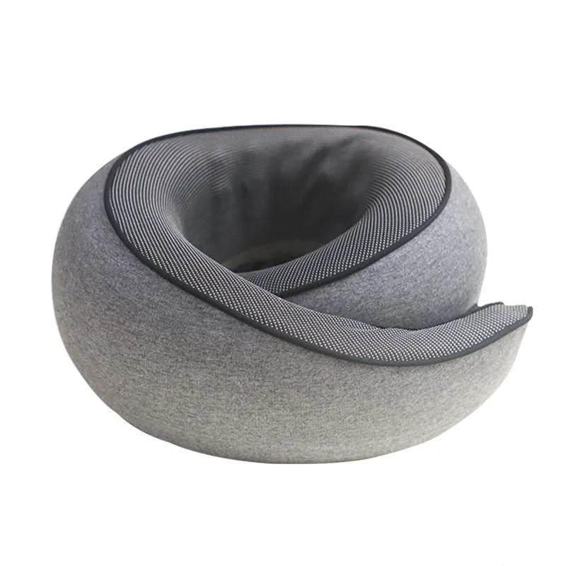 A U-shaped memory foam travel neck pillow in a modern design, shown with its storage bag.