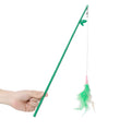Green interactive cat feather wand toy with bell attachment on a durable stick