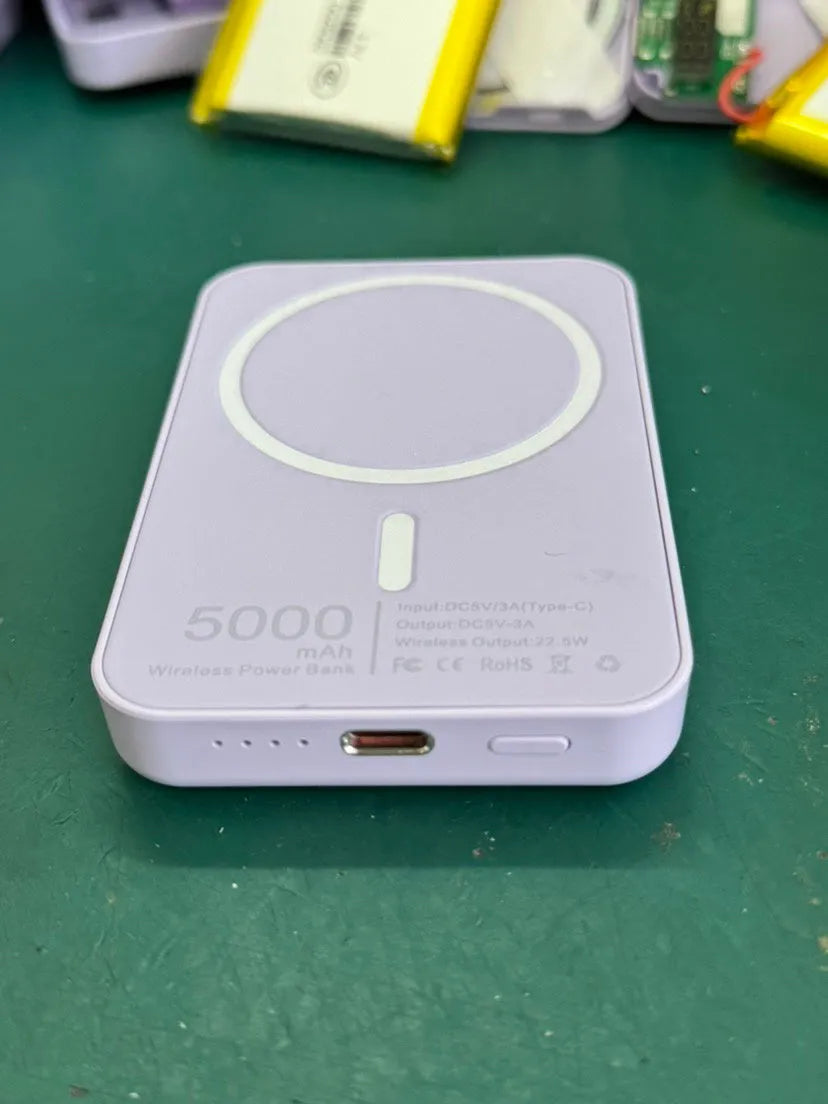 Portable magnetic wireless charger in white with 5000mAh capacity showing compact dimensions