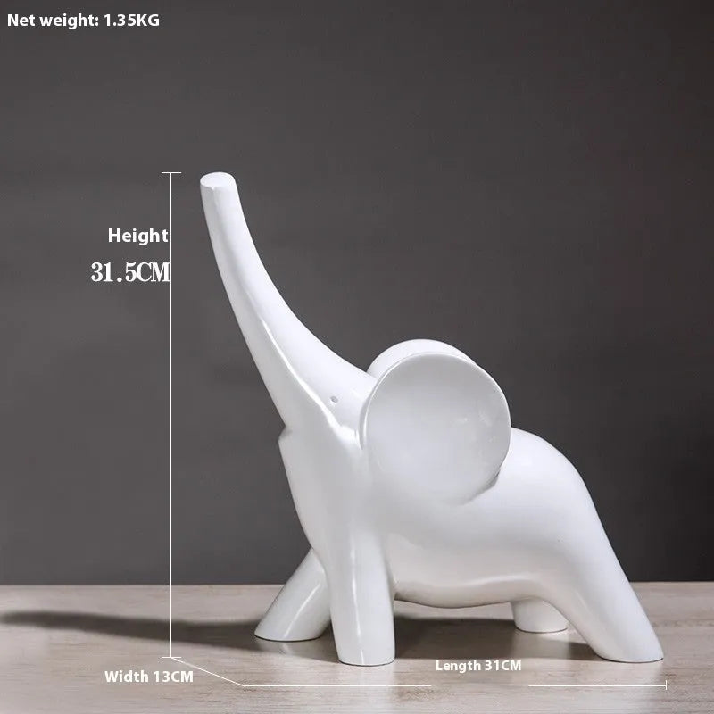 Modern minimalist elephant figurine ornament in rose gold or white resin on a plain background.