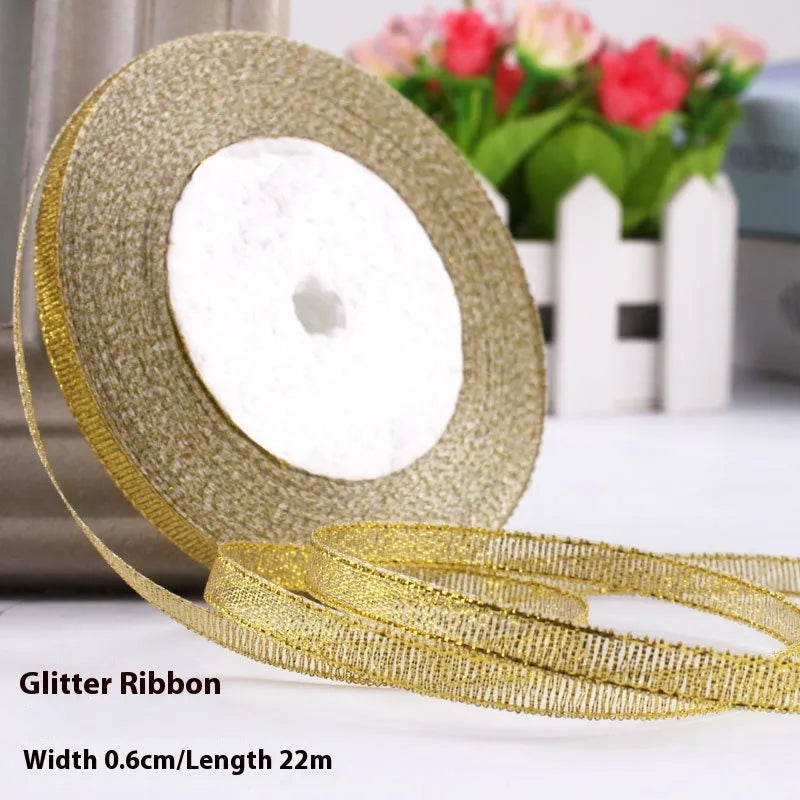 Roll of narrow 0.6cm wide polyester gift ribbon in a multicolour pattern.