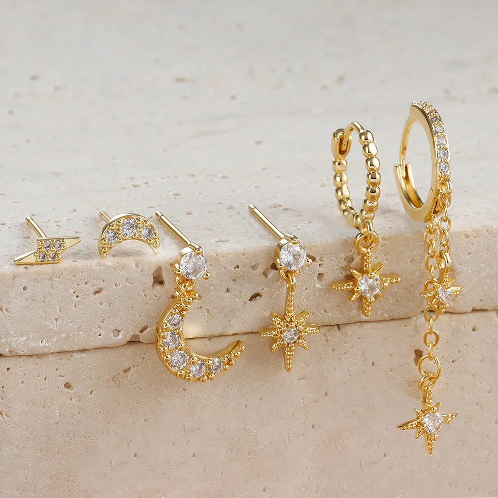 XINGX six-pair gold chain tassel earrings set with zircon studs on jewellery display