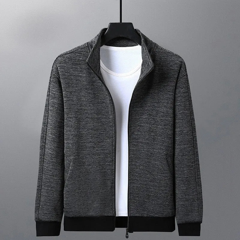 Man wearing a grey athletic-fit casual jacket with a stand-up collar and front zip.
