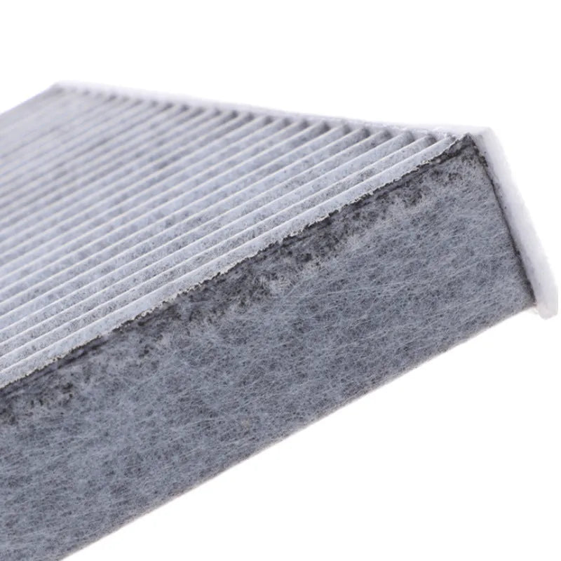 Grey Geely car cabin air conditioning filter element measuring 215mm by 210mm.