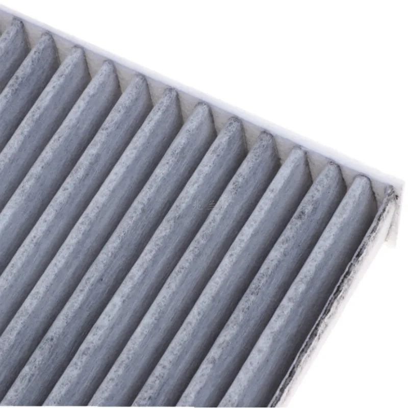 Grey Geely car cabin air conditioning filter element measuring 215mm by 210mm.