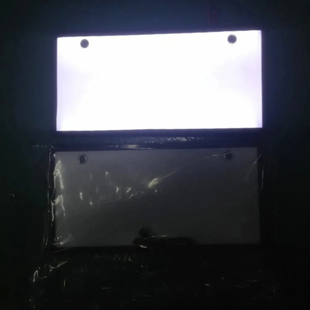 Two white LED truck licence plate lights with flat thin plastic housings and visible LED lamp bars.