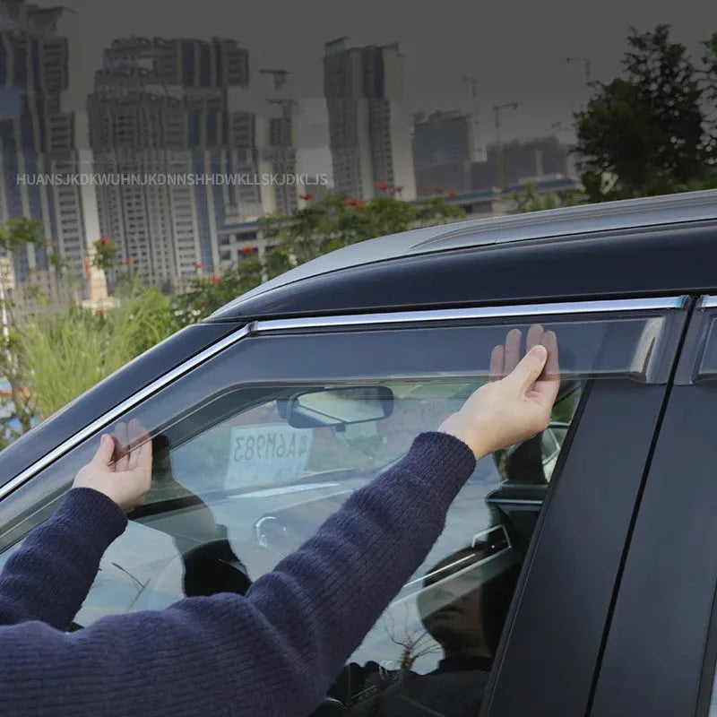 2023 Mitsubishi Outlander with black window deflectors installed on side windows