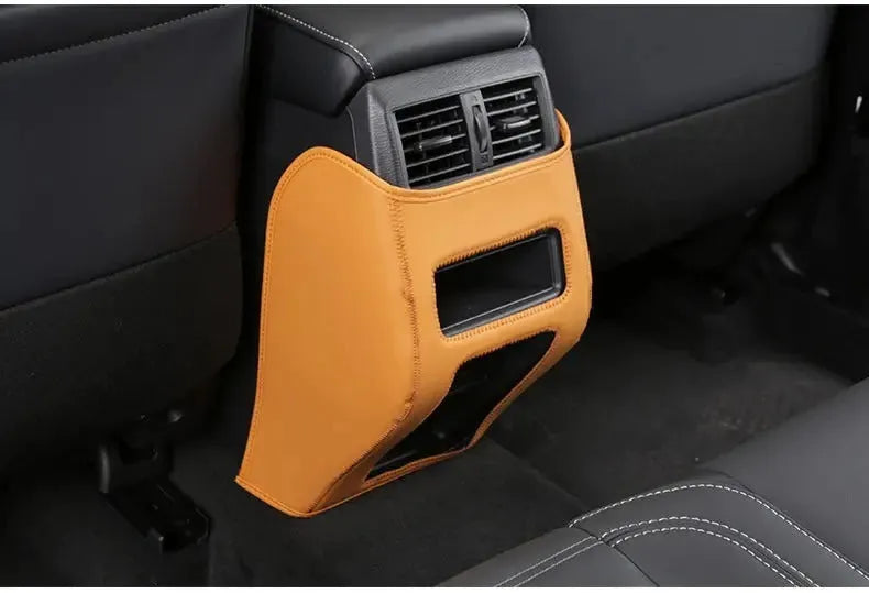 Three genuine leather anti-kick pads for Mitsubishi Outlander seat and console protection.
