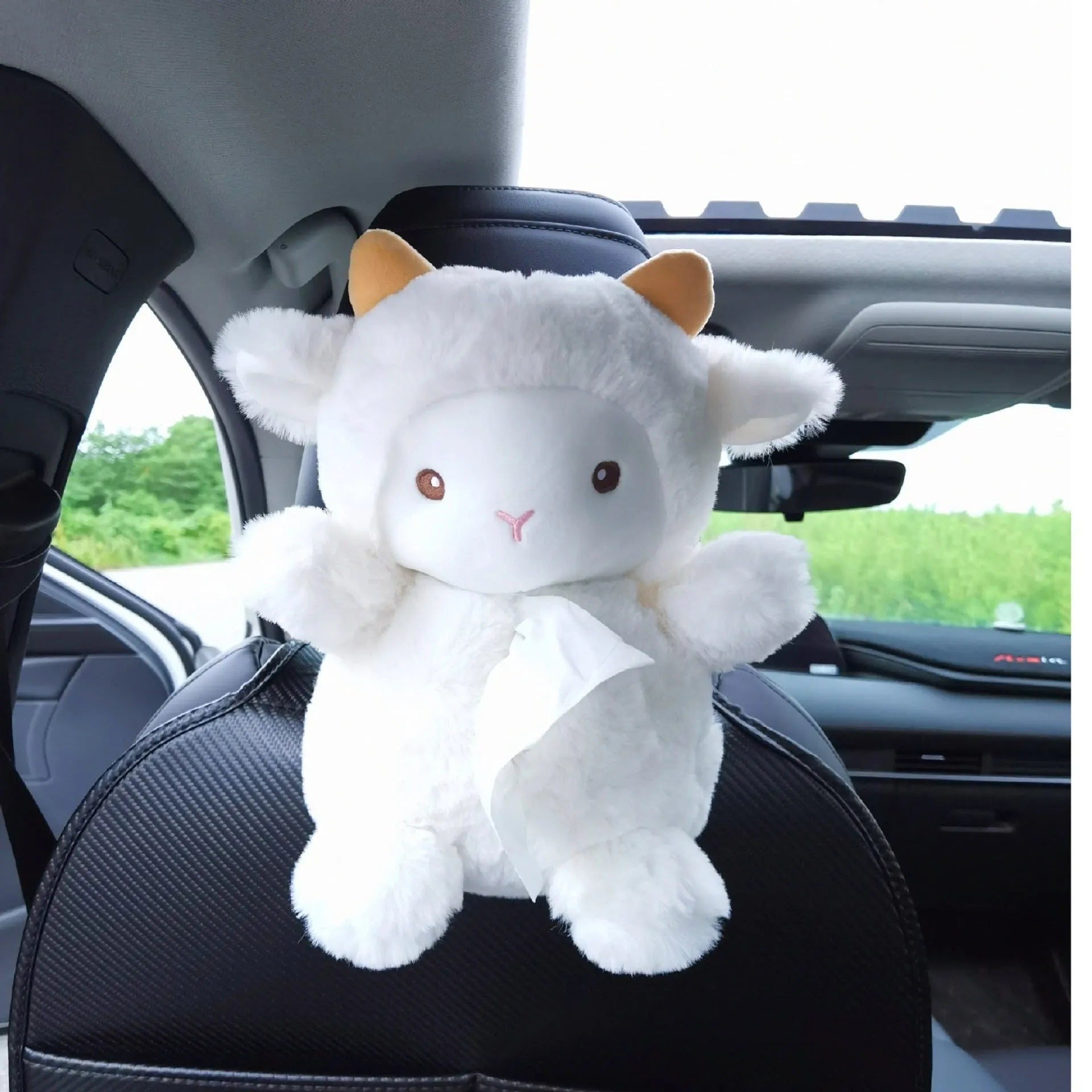 Soft plush car tissue box cover in a cartoon lamb design on a car seat.