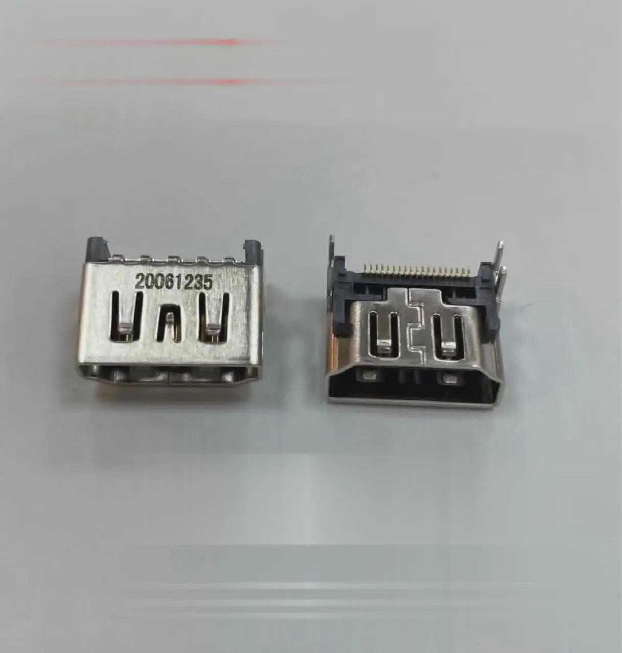 Silver coloured HDMI host socket interface for gaming console accessory.