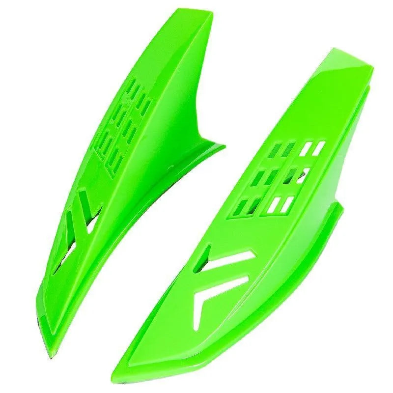 A pair of black plastic decorative horns for children's helmets with visible 3M adhesive backing.