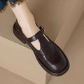 Women's brown sheepskin leather flat shoes with round toe design showing UK size label