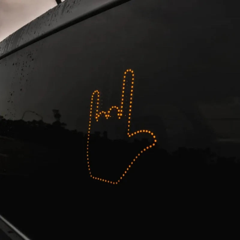 Black plastic LED gesture car light with remote control showing middle finger and other road communication symbols