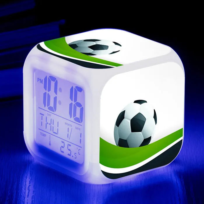Square cartoon football pattern mute alarm clock for students and children on a desk.