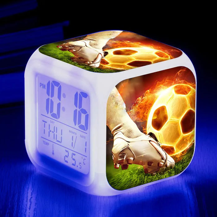 Square cartoon football pattern mute alarm clock for students and children on a desk.