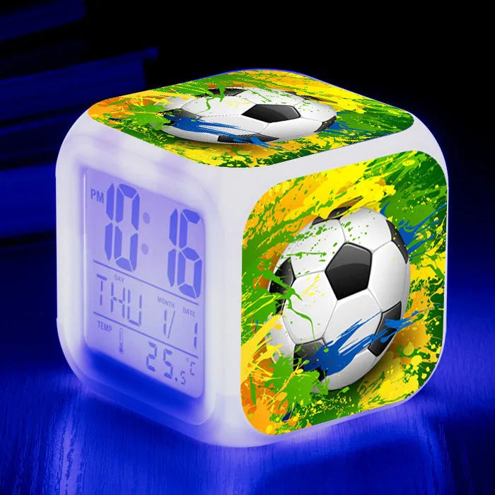 Square cartoon football pattern mute alarm clock for students and children on a desk.