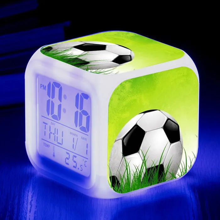 Square cartoon football pattern mute alarm clock for students and children on a desk.