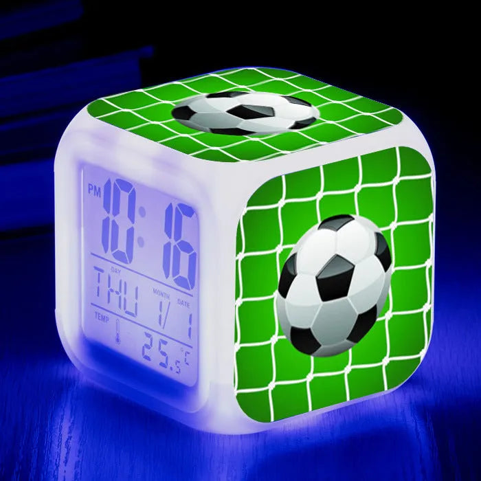 Square cartoon football pattern mute alarm clock for students and children on a desk.