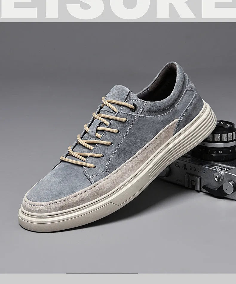 Men's grey casual leather skate shoes with low-top design and round toe on a rubber sole.