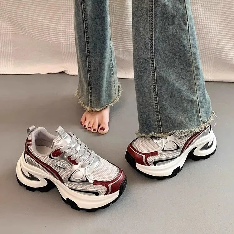 Women's silver and red mesh breathable clunky platform sneakers with a rubber sole.