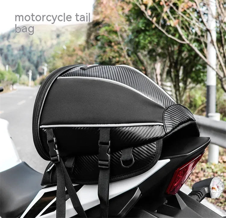 Black motorcycle seat bag with reflective lines and adjustable hooks for fuel tank or rear seat mounting