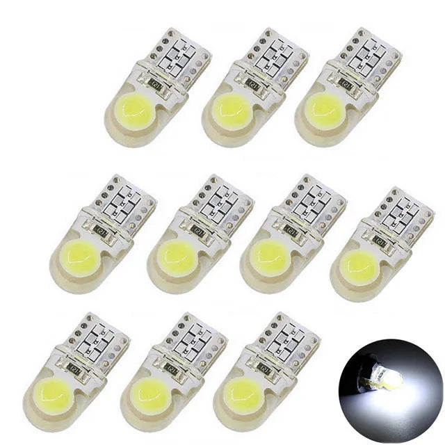 Ten T10 wedge base LED bulbs with silicone housing in a pack, showing multiple colour options