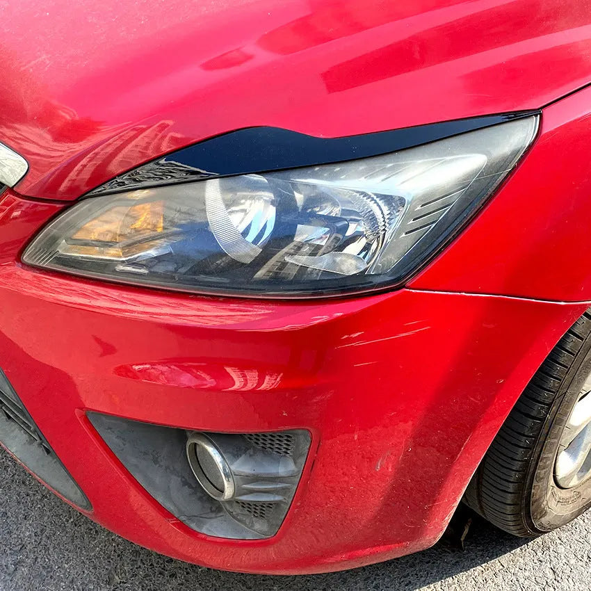 Ford Focus headlight eyebrow stickers in carbon fibre pattern or piano black ABS plastic