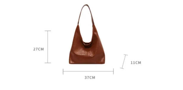 Soft PU leather large capacity shoulder bag in black with a sandwich pocket and contrasting stitching.