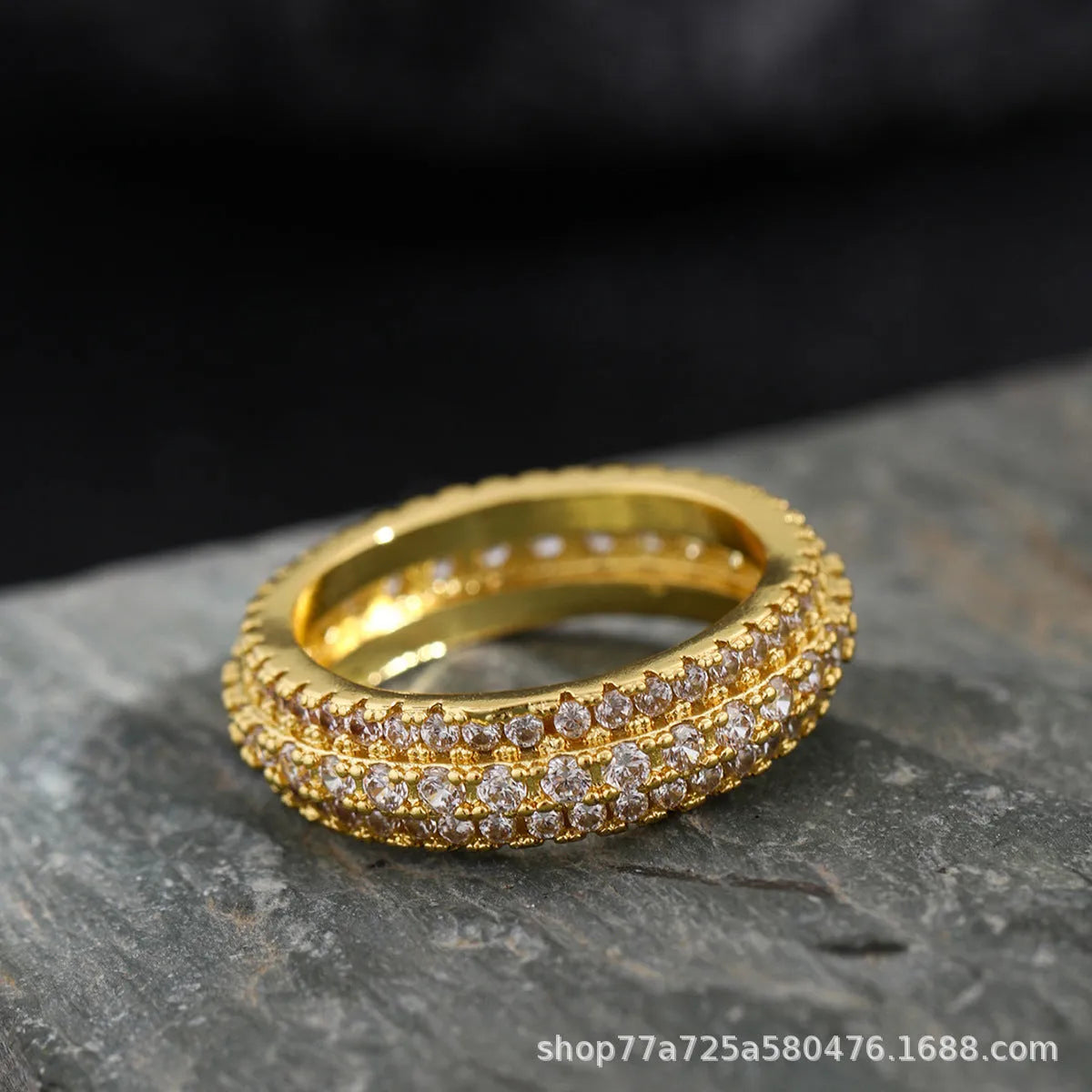 Geometric personalised ring with triangular design and zircon stone, shown in a gold colour finish.