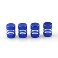 Assortment of aluminium alloy car tyre valve caps in ten different colours on a grey background.