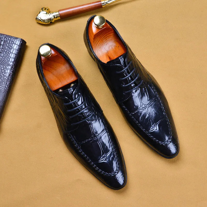 Men's brown leather loafers with a shiny horsebit buckle detail on the front, shown on a foot.
