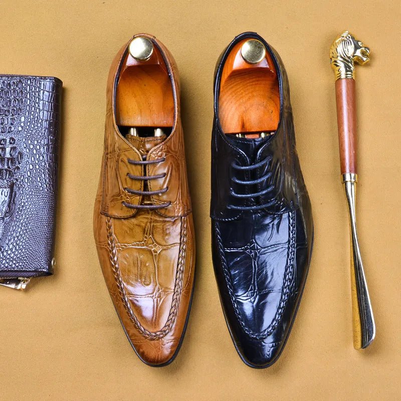 Men's brown leather loafers with a shiny horsebit buckle detail on the front, shown on a foot.
