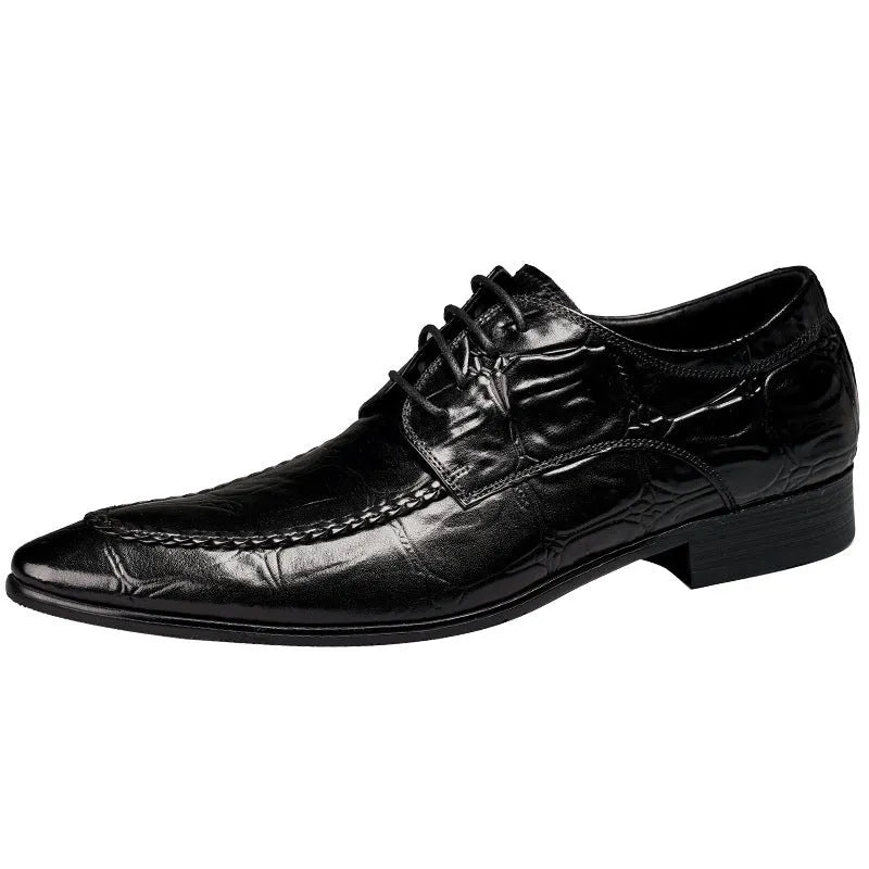 Men's brown leather loafers with a shiny horsebit buckle detail on the front, shown on a foot.