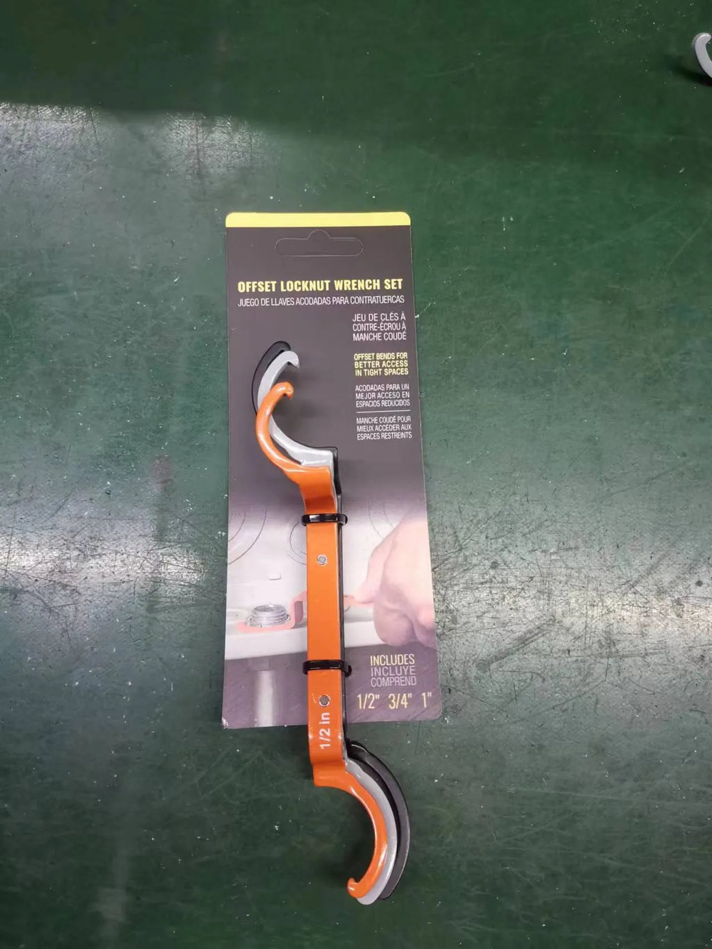 Three colour-coded magnetic suction catheter locking wrenches: orange, grey, and black, arranged as a tool set.