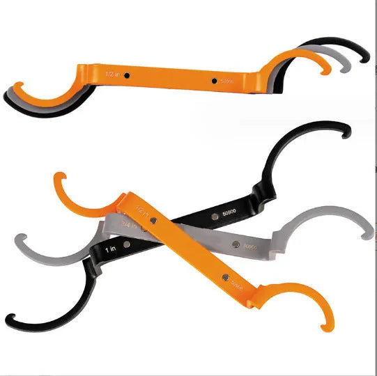 Three colour-coded magnetic suction catheter locking wrenches: orange, grey, and black, arranged as a tool set.