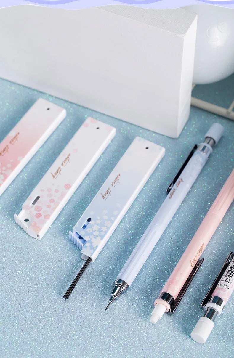 Mixed colour cartoon automatic pencil set with three 0.5mm pens and three boxes of HB refills.