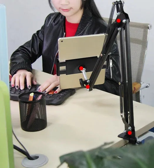 Adjustable black phone and tablet stand with 10cm base on a wooden desk
