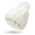 Women's knitted beanie hat with faux fur pom pom and satin lining in multiple colour options.