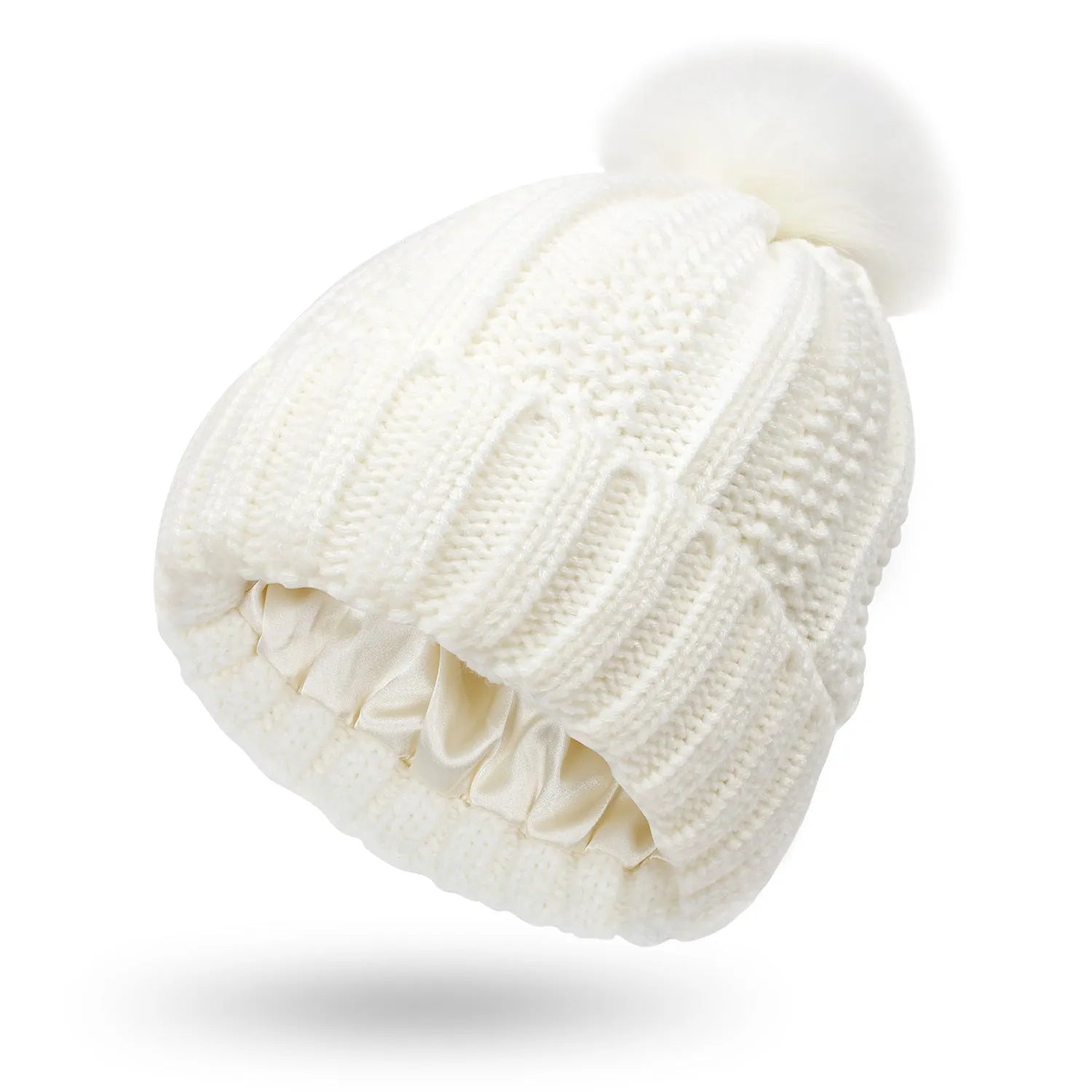 Women's knitted beanie hat with faux fur pom pom and satin lining in multiple colour options.
