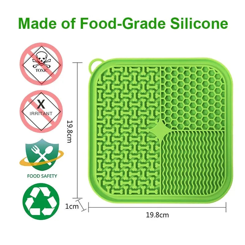 Blue silicone dog licking mat with textured surface and suction cups on a clean floor.