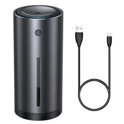 Black aluminium alloy car humidifier with USB cable and 12V car adapter plug on a desk.