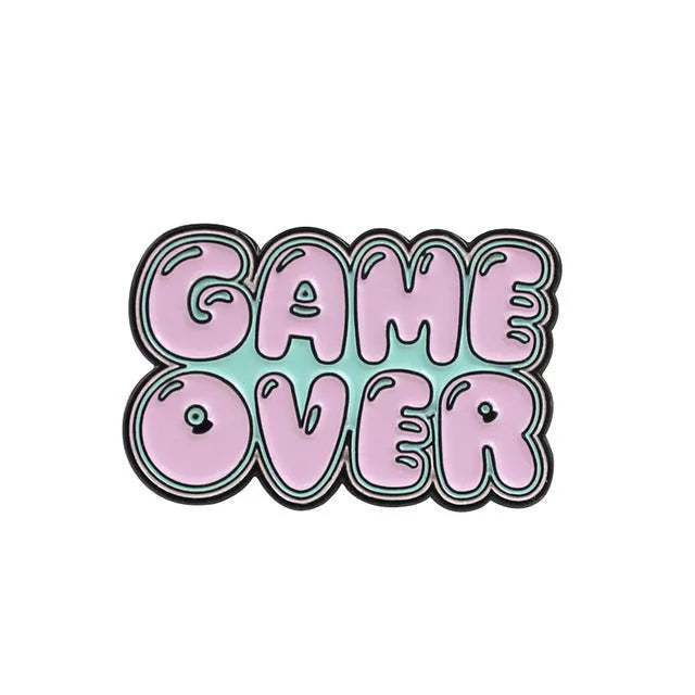 Solid alloy metal game console badge pin on a clear OPP packaging background.