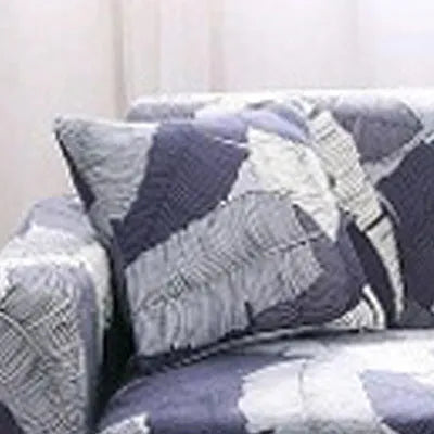 Geometric patterned stretch sofa slipcover fitted on a three-seater sofa