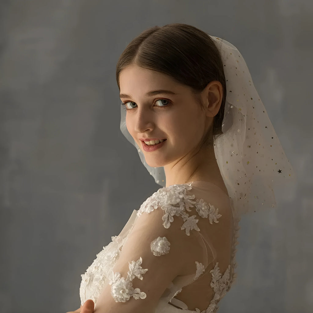 White yarn bridal multi-layer short veil with hair comb on a neutral background