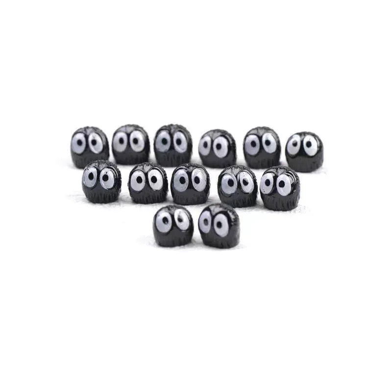 Cartoon car black briquette resin decorations approximately 1cm with traceless tape for display.