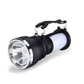 Black solar-charging LED emergency flashlight with USB port for outdoor use.