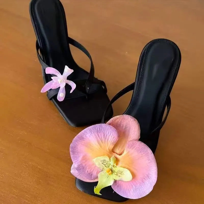 Handmade women's asymmetric flower sandals with high heel and square toe in black, green, pink, or white