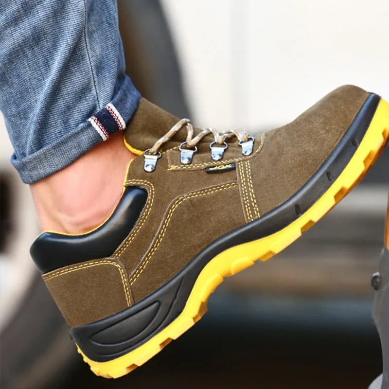Bronze coloured cow suede leather safety shoes with a steel toe cap and low-cut design.