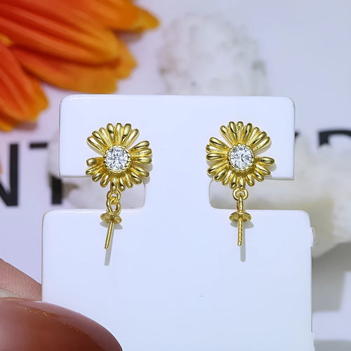 Adjustable Baroque style sterling silver flower drop earrings on a ring holder ear wire.