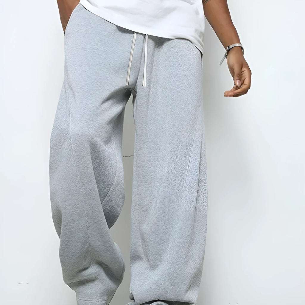 Men's solid colour polyester trousers with straight leg and drawstring waist in black, dark grey, light grey